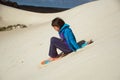 Sandboard surfing Royalty Free Stock Photo