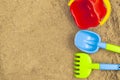 Sandbox outdoor. Children`s sand toys: shovel, rake and bucket. Summer concept. Royalty Free Stock Photo