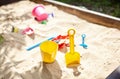 Sandbox outdoor. Children`s wooden sandbox with various toys for the game Royalty Free Stock Photo