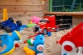 Children& x27;s wooden sandbox with various toys for the game. Royalty Free Stock Photo
