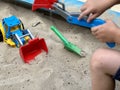 Sandbox outdoor. Children& x27;s wooden sandbox with various toys for the game. Summer concept. Royalty Free Stock Photo