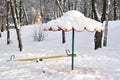 Sandbox and a swing in winter