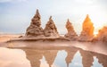 Sandcastle on the beach with beautiful sunset sky in summer vacation time Royalty Free Stock Photo