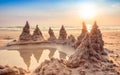 Sandcastle on the beach with beautiful sunset sky in summer vacation time Royalty Free Stock Photo