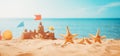 Sandcastle on the beach at sea in summertime Royalty Free Stock Photo