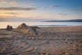 Sandcastle on beach at sunrise Royalty Free Stock Photo