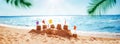 Sandcastle on the blue sea in summertime Royalty Free Stock Photo