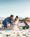 Sandcastle, holiday and children at the beach with family, love and support. Baby, mom and dad together with kids Royalty Free Stock Photo