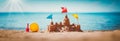 Sandcastle on the sea in summertime Royalty Free Stock Photo