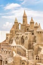 Sandcastle during a sunny day with blue sky background. Concept for summer, vacation and fun Royalty Free Stock Photo