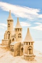 Sandcastle during a sunny day with blue sky background. Concept for summer, vacation and fun Royalty Free Stock Photo