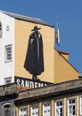 The Sandeman Don painted on the outside of a building in Ribeira, a historic neighborhood in Porto, Portugal.