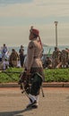 SANDF Band Member wearing full scottish regalia and carrying a bagpipe