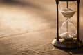 A sandglass, modern hourglass or egg timer with shadow showing the last second or last minute or time out. Royalty Free Stock Photo