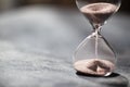 A sandglass, modern hourglass or egg timer with shadow showing the last second or last minute or time out. Royalty Free Stock Photo