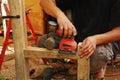 Sanding a Chair Frame Royalty Free Stock Photo