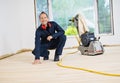 A Sanding hardwood floor with the grinding machine. Royalty Free Stock Photo