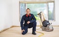 A Sanding hardwood floor with the grinding machine. Royalty Free Stock Photo