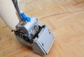 Sanding hardwood floor with the grinding machine Royalty Free Stock Photo