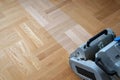 Sanding parquet with the grinding machine