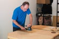 Sanding And Refinishing A Tabletop Royalty Free Stock Photo