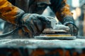 Sanding surfaces close-up of a worker using sandpaper or a sander to smooth surfaces before painting or refinishing