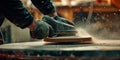 Sanding surfaces close-up of a worker using sandpaper or a sander to smooth surfaces before painting or refinishing