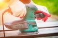 Sanding a wood with orbital sander Royalty Free Stock Photo