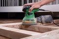 sanding wooden doors with a grinder, restoration cleaning doors before painting