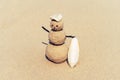 Sandman, doll from sand, snowman by the beach Royalty Free Stock Photo