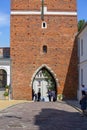 14th century gothic entrance Opatowska Gate, view of Opatowska Street, Sandomierz, Poland Royalty Free Stock Photo