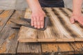 Sandpaper wood treatment/type of male hands processing sandpaper wood