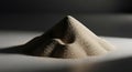 Sandpile with Fine Granules on Flat Surface in Dim Lighting Royalty Free Stock Photo