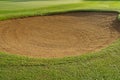 sandpit bunker golf course backgrounds, The sandpit on the golf course fairway is used as a hurdle for athletes to compete Royalty Free Stock Photo