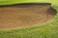 sandpit bunker golf course backgrounds, The sandpit on the golf course fairway is used as a hurdle for athletes to compete Royalty Free Stock Photo