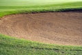 sandpit bunker golf course backgrounds, The sandpit on the golf course fairway is used as a hurdle for athletes to compete Royalty Free Stock Photo