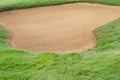 sandpit bunker golf course backgrounds, The sandpit on the golf course fairway is used as a hurdle for athletes to compete Royalty Free Stock Photo