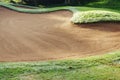 sandpit bunker golf course backgrounds, The sandpit on the golf course fairway is used as a hurdle for athletes to compete Royalty Free Stock Photo