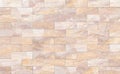 Sandstone brick wall patterned (natural patterns) texture background. Royalty Free Stock Photo