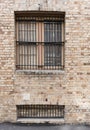 Sandstone brick wall with two windows Royalty Free Stock Photo