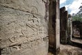 A sandstone carving on a pillar depicting an Apsara dancing in bas-relief in the hall of Bayon Temple in Angkor Thom