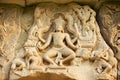 Sandstone carving with religious motifs at the ruins of the Hindu temple in Phimai historical park Prasat Hin Phimai in Thailand