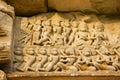 Sandstone carving with religious motifs at the ruins of the Hindu temple in Phimai historical park Prasat Hin Phimai in Thailand