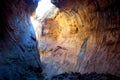 Sandstone cave with narrow opening above Royalty Free Stock Photo