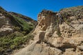 Sandstone cliff with Pirate Skull markings on beach