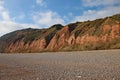 The sandstone cliffs of the Jurassic era rising from Salcombe Regis beach