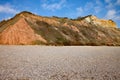 The sandstone cliffs of the Jurassic era rising from Salcombe Regis beach