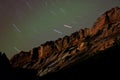 Sandstone Cliffs at Night with Star Trails