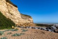 The sandstone cliffs at Pett Level with a clear blue sky overhead