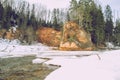 Sandstone cliffs on the river shore in the Gaujas National Park, Latvia Royalty Free Stock Photo